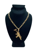 Gold Colored Chain With Gun Pendant